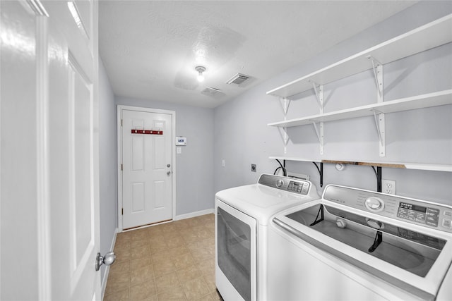 21142 Granite Trail Ln, Richmond, TX 77407 - washroom with independent washer and dryer and a textured ceiling