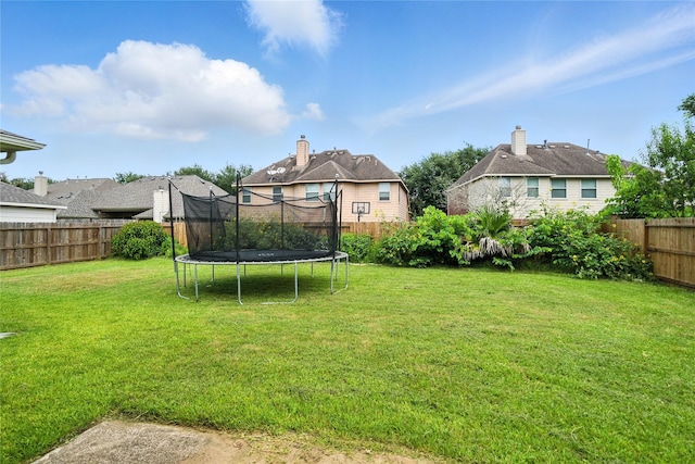21142 Granite Trail Ln, Richmond, TX 77407 - fenced backyard with a trampoline and a residential view