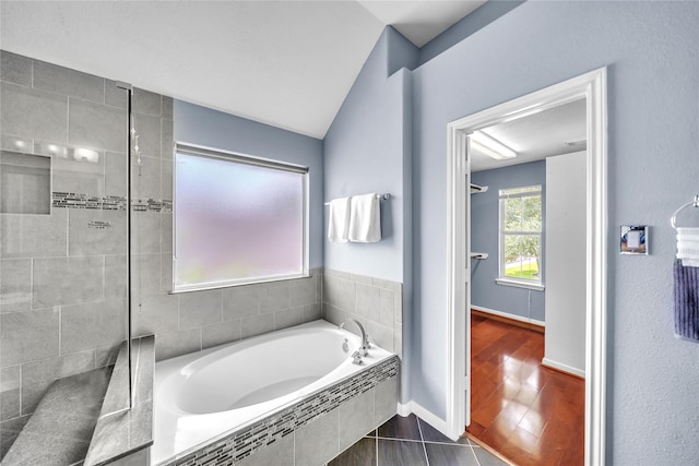 21142 Granite Trail Ln, Richmond, TX 77407 - full bathroom featuring a garden tub, vaulted ceiling, and tiled shower