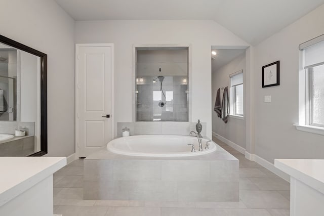 29726 Smoky Ridge Rd, Fulshear, TX 77441 - bathroom with vanity, a bath, tile patterned floors, and lofted ceiling