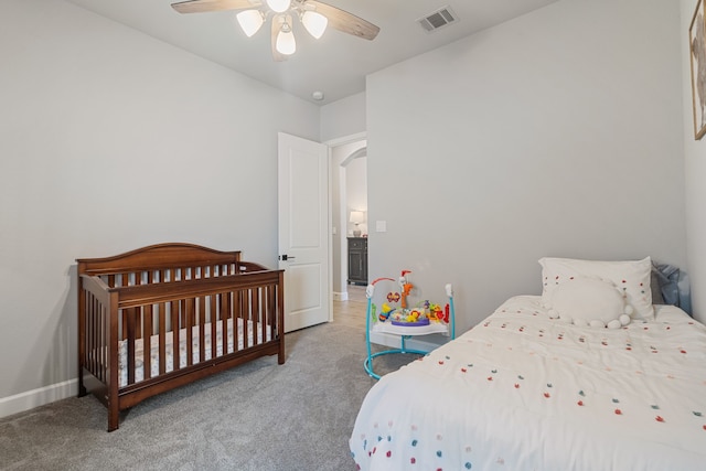 29726 Smoky Ridge Rd, Fulshear, TX 77441 - carpeted bedroom with ceiling fan and arched walkways