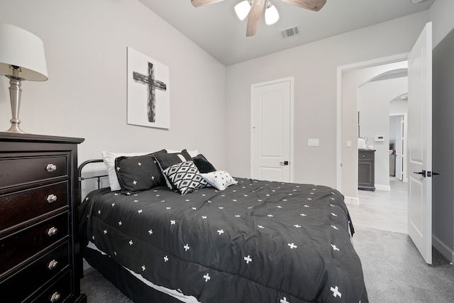 29726 Smoky Ridge Rd, Fulshear, TX 77441 - bedroom with arched walkways, light carpet, and a ceiling fan