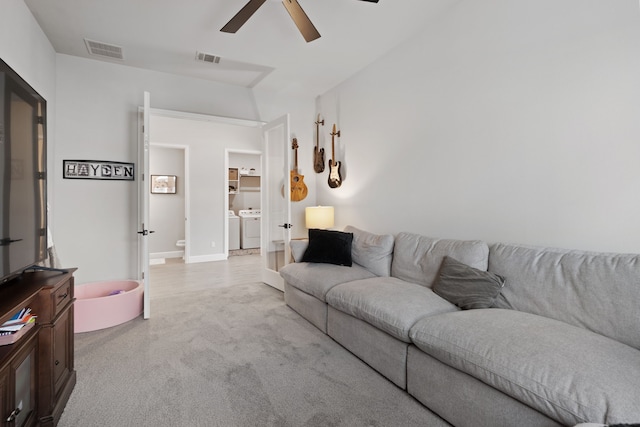 29726 Smoky Ridge Rd, Fulshear, TX 77441 - living area featuring washer and clothes dryer, ceiling fan, and light colored carpet