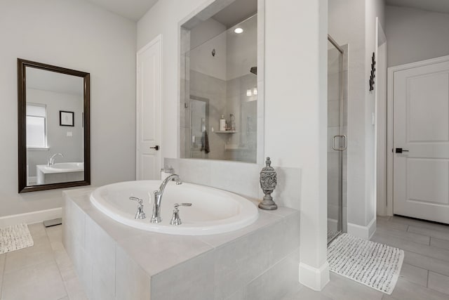 29726 Smoky Ridge Rd, Fulshear, TX 77441 - bathroom with a shower stall, a bath, and tile patterned flooring