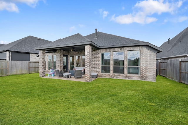 29726 Smoky Ridge Rd, Fulshear, TX 77441 - back of house with brick siding, a ceiling fan, a shingled roof, and a patio