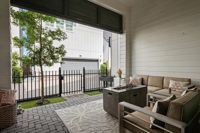 1217 Timbergrove Acres St, Houston, TX 77008 - view of patio with a garage and an outdoor living space with a fire pit