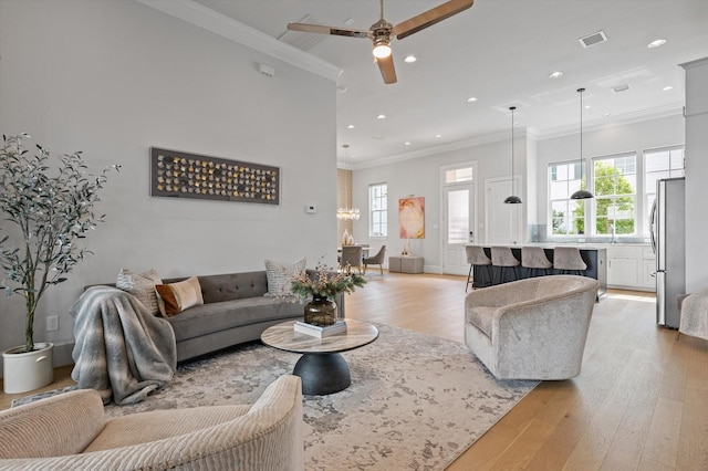 1217 Timbergrove Acres St, Houston, TX 77008 - living room with light wood-style floors, crown molding, healthy amount of natural light, ceiling fan, and recessed lighting