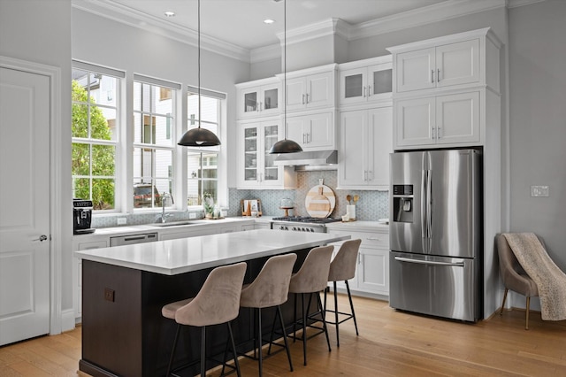 1217 Timbergrove Acres St, Houston, TX 77008 - kitchen with stainless steel fridge, a kitchen island, white cabinetry, decorative backsplash, and recessed lighting