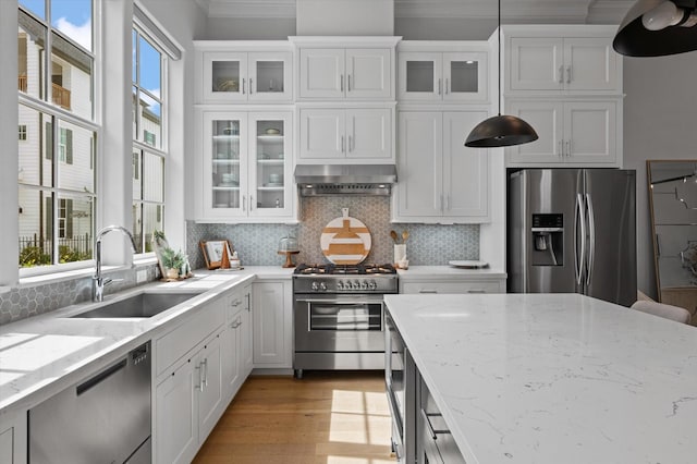 1217 Timbergrove Acres St, Houston, TX 77008 - kitchen featuring stainless steel appliances, ventilation hood, white cabinetry, and crown molding