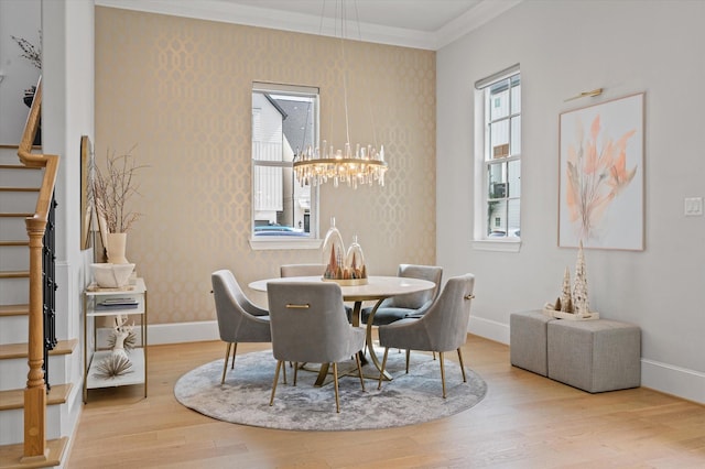1217 Timbergrove Acres St, Houston, TX 77008 - dining room featuring wood finished floors, wallpapered walls, a chandelier, crown molding, and stairs