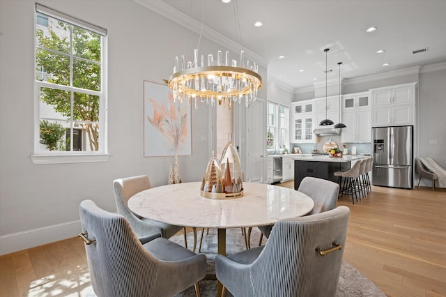 1217 Timbergrove Acres St, Houston, TX 77008 - dining space featuring crown molding, light wood-style floors, a chandelier, and recessed lighting