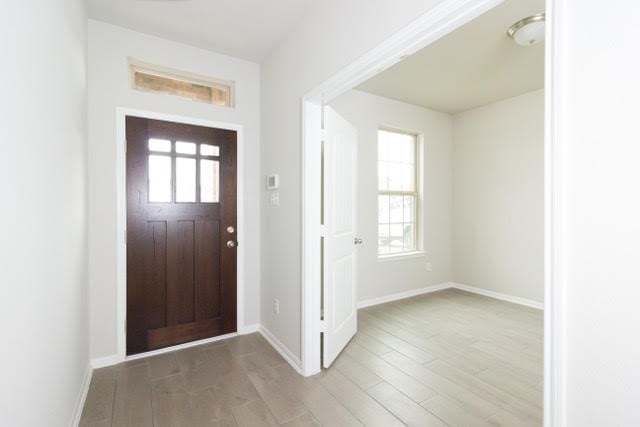 5018 Brewcastle Ln, Katy, TX 77493 - foyer featuring light wood-type flooring and baseboards