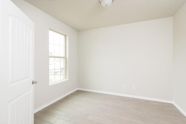 5018 Brewcastle Ln, Katy, TX 77493 - spare room with healthy amount of natural light and light wood-style floors