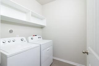 5018 Brewcastle Ln, Katy, TX 77493 - washroom with washer and clothes dryer and baseboards