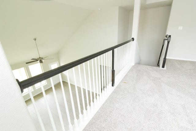 5018 Brewcastle Ln, Katy, TX 77493 - corridor with an upstairs landing, lofted ceiling, and carpet flooring