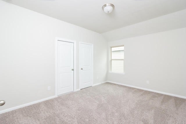5018 Brewcastle Ln, Katy, TX 77493 - unfurnished bedroom featuring carpet floors and lofted ceiling