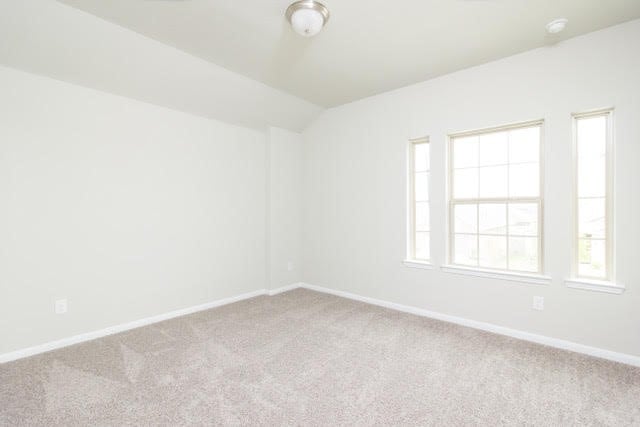 5018 Brewcastle Ln, Katy, TX 77493 - empty room featuring carpet flooring and vaulted ceiling