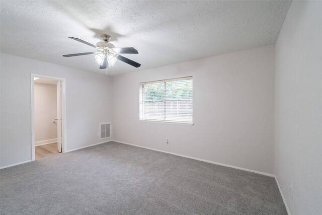 7911 Bova Rd, Houston, TX 77064 - spare room featuring carpet floors, a textured ceiling, and a ceiling fan