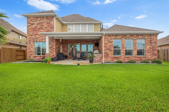 4802 Wagtail Way Ln, League City, TX 77573 - rear view of property featuring brick siding, a fenced backyard, a patio area, and roof with shingles