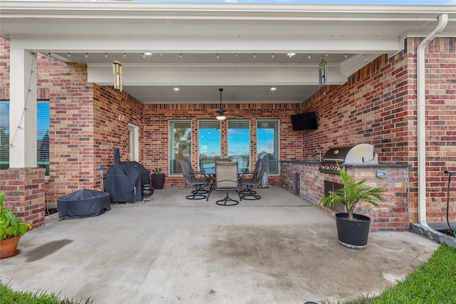 4802 Wagtail Way Ln, League City, TX 77573 - view of patio / terrace featuring exterior kitchen and outdoor dining space