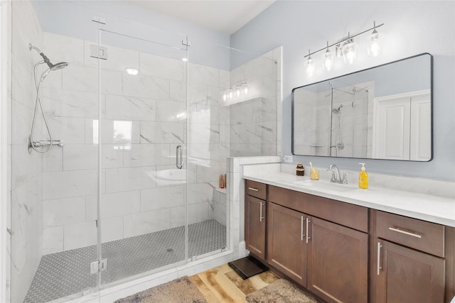 4802 Wagtail Way Ln, League City, TX 77573 - bathroom with vanity, a shower stall, and wood finished floors
