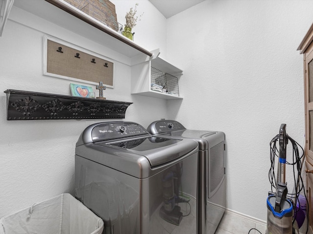 3327 Jane Way, Richmond, TX 77406 - laundry area with independent washer and dryer and tile patterned floors