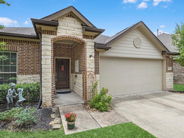 3327 Jane Way, Richmond, TX 77406 - view of front of property featuring brick siding, roof with shingles, a garage, driveway, and stone siding