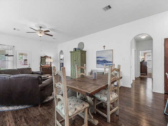 3327 Jane Way, Richmond, TX 77406 - dining area featuring arched walkways, ceiling fan, and dark wood finished floors