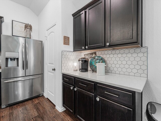 3327 Jane Way, Richmond, TX 77406 - kitchen featuring stainless steel refrigerator with ice dispenser, dark wood-style floors, tasteful backsplash, light countertops, and lofted ceiling
