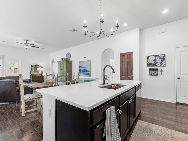 3327 Jane Way, Richmond, TX 77406 - kitchen with arched walkways, ceiling fan, light countertops, open floor plan, and a chandelier