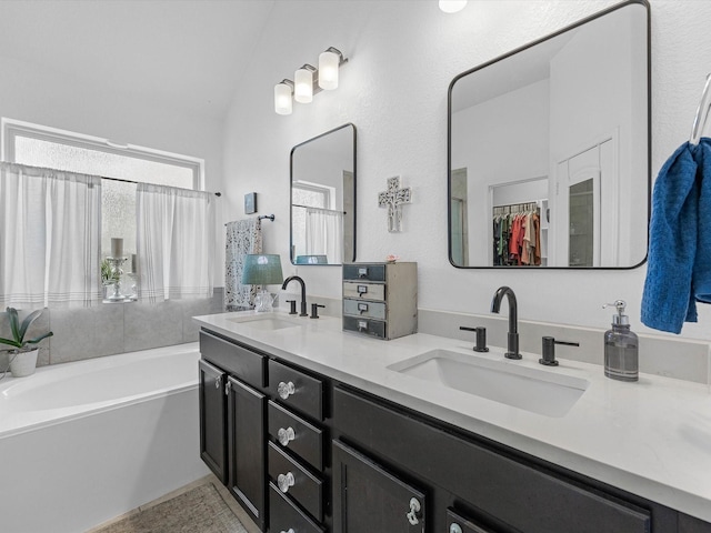 3327 Jane Way, Richmond, TX 77406 - full bath with double vanity, a bath, vaulted ceiling, and a walk in closet