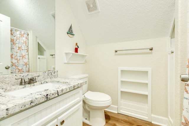 1214 Fort Velasco Dr, Surfside Beach, TX 77541 - full bath featuring wood finished floors, vanity, and lofted ceiling