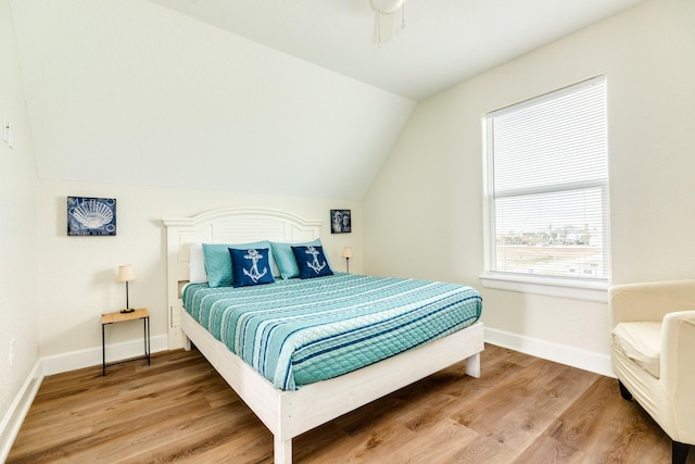 1214 Fort Velasco Dr, Surfside Beach, TX 77541 - bedroom with vaulted ceiling and wood finished floors