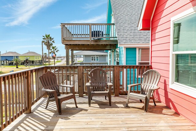 1214 Fort Velasco Dr, Surfside Beach, TX 77541 - wooden deck featuring a residential view