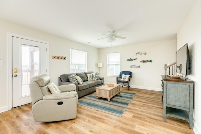 1214 Fort Velasco Dr, Surfside Beach, TX 77541 - living room featuring light wood-style flooring and ceiling fan