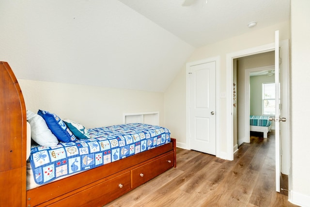 1214 Fort Velasco Dr, Surfside Beach, TX 77541 - bedroom with lofted ceiling, wood finished floors, and a ceiling fan