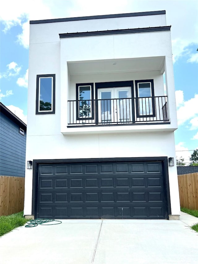 153 Treasure Dr, Houston, TX 77076 - view of front of house with a balcony, stucco siding, and concrete driveway