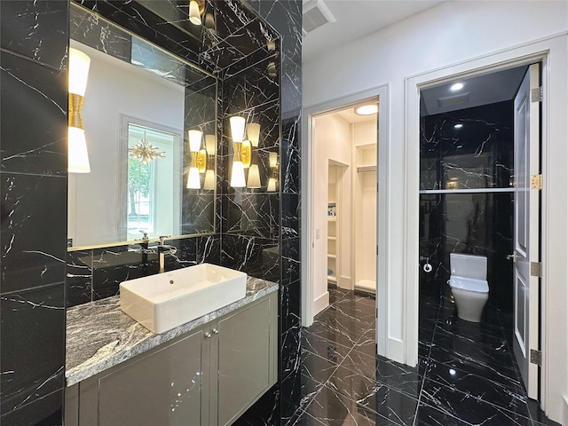 3818 Drake St, Houston, TX 77005 - full bath featuring vanity, marble tiled floors, and a walk in closet