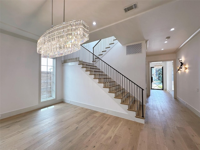 3818 Drake St, Houston, TX 77005 - staircase with plenty of natural light, hardwood / wood-style flooring, a chandelier, recessed lighting, and crown molding