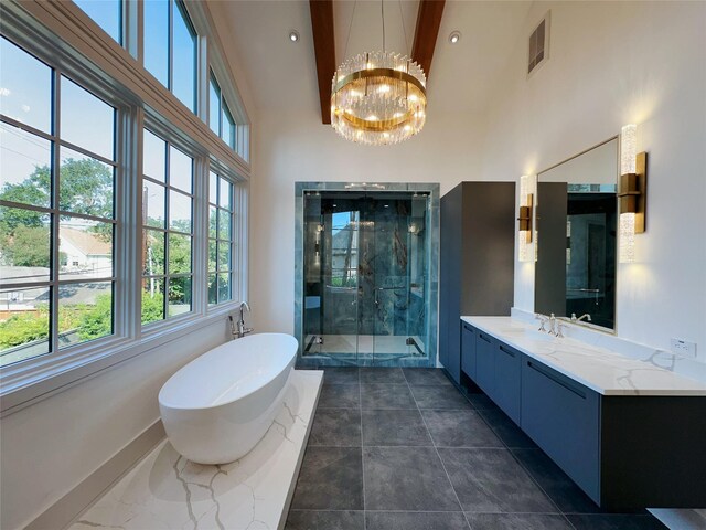 3818 Drake St, Houston, TX 77005 - bathroom featuring high vaulted ceiling, a shower stall, vanity, a freestanding tub, and a chandelier