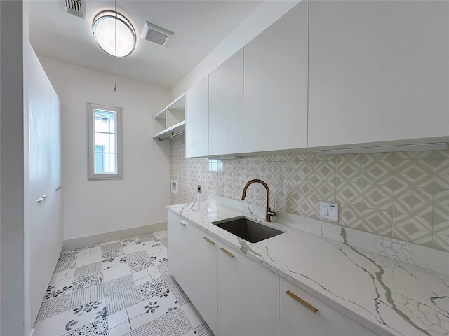 3818 Drake St, Houston, TX 77005 - washroom with cabinet space and electric dryer hookup