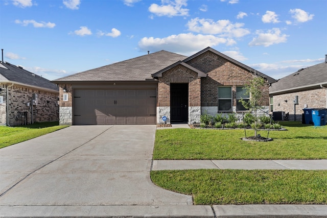 20214 Portbec Dr, New Caney, TX 77357 - single story home with concrete driveway, a garage, stone siding, a front yard, and brick siding