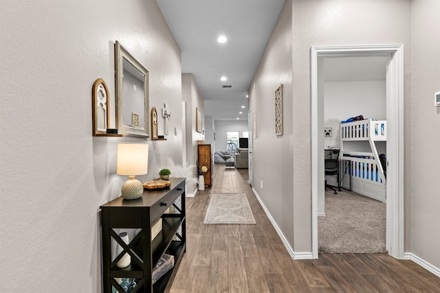 20214 Portbec Dr, New Caney, TX 77357 - corridor featuring dark wood-style flooring, a textured wall, and recessed lighting