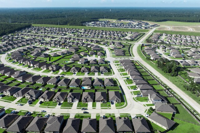 20214 Portbec Dr, New Caney, TX 77357 - aerial overview of property's location with a forest and nearby suburban area