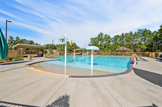 20214 Portbec Dr, New Caney, TX 77357 - community pool featuring a patio