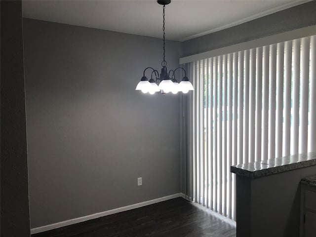 5625 Antoine Dr Unit 903, Houston, TX 77091 - unfurnished room with a chandelier and dark wood-type flooring