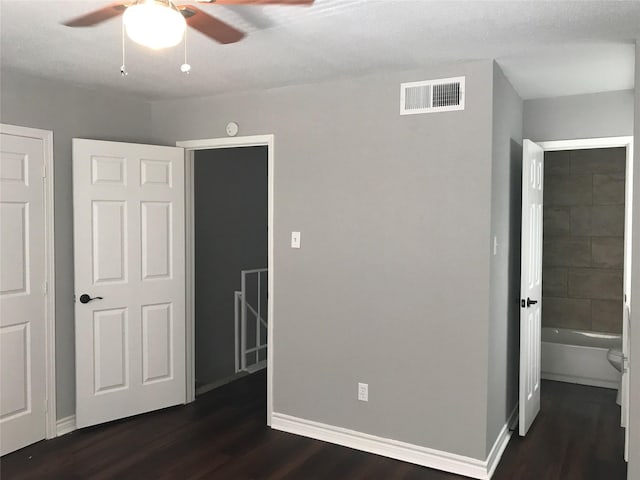 5625 Antoine Dr Unit 903, Houston, TX 77091 - unfurnished bedroom with dark wood-type flooring and ceiling fan