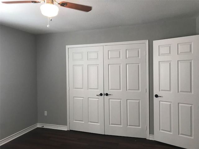 5625 Antoine Dr Unit 903, Houston, TX 77091 - unfurnished bedroom with dark wood finished floors, a closet, and a ceiling fan