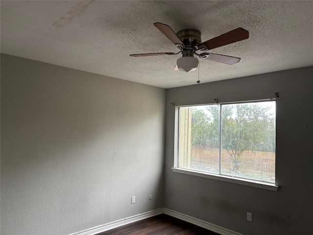 5625 Antoine Dr Unit 903, Houston, TX 77091 - unfurnished room featuring dark wood finished floors, a textured ceiling, and a ceiling fan