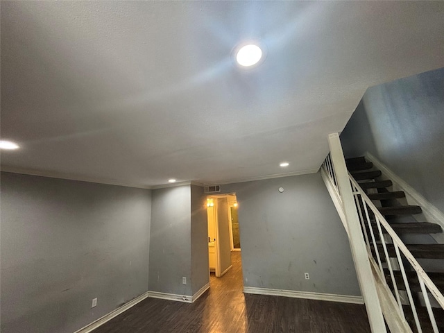 5625 Antoine Dr Unit 903, Houston, TX 77091 - basement featuring dark wood-style floors, stairs, and recessed lighting